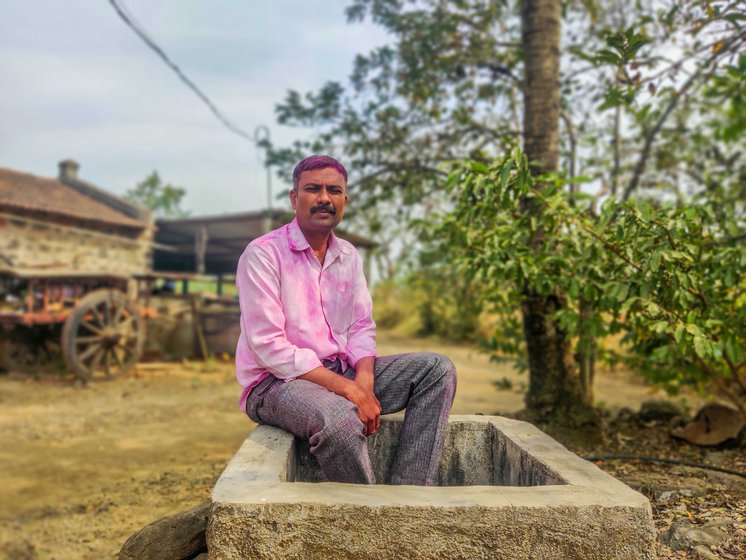 Arun Jadhav outside his cowshed in Alsund