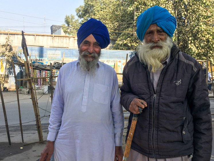 Tanna Singh with 85-year-old Joginder Singh, who has been staying in the same tent, as did many others who came from his village to the protest site