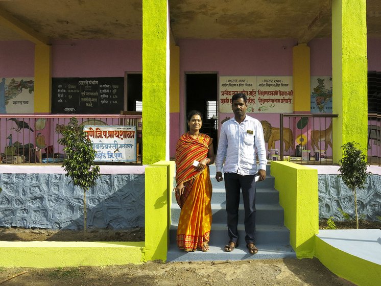 Teachers standing outside school
