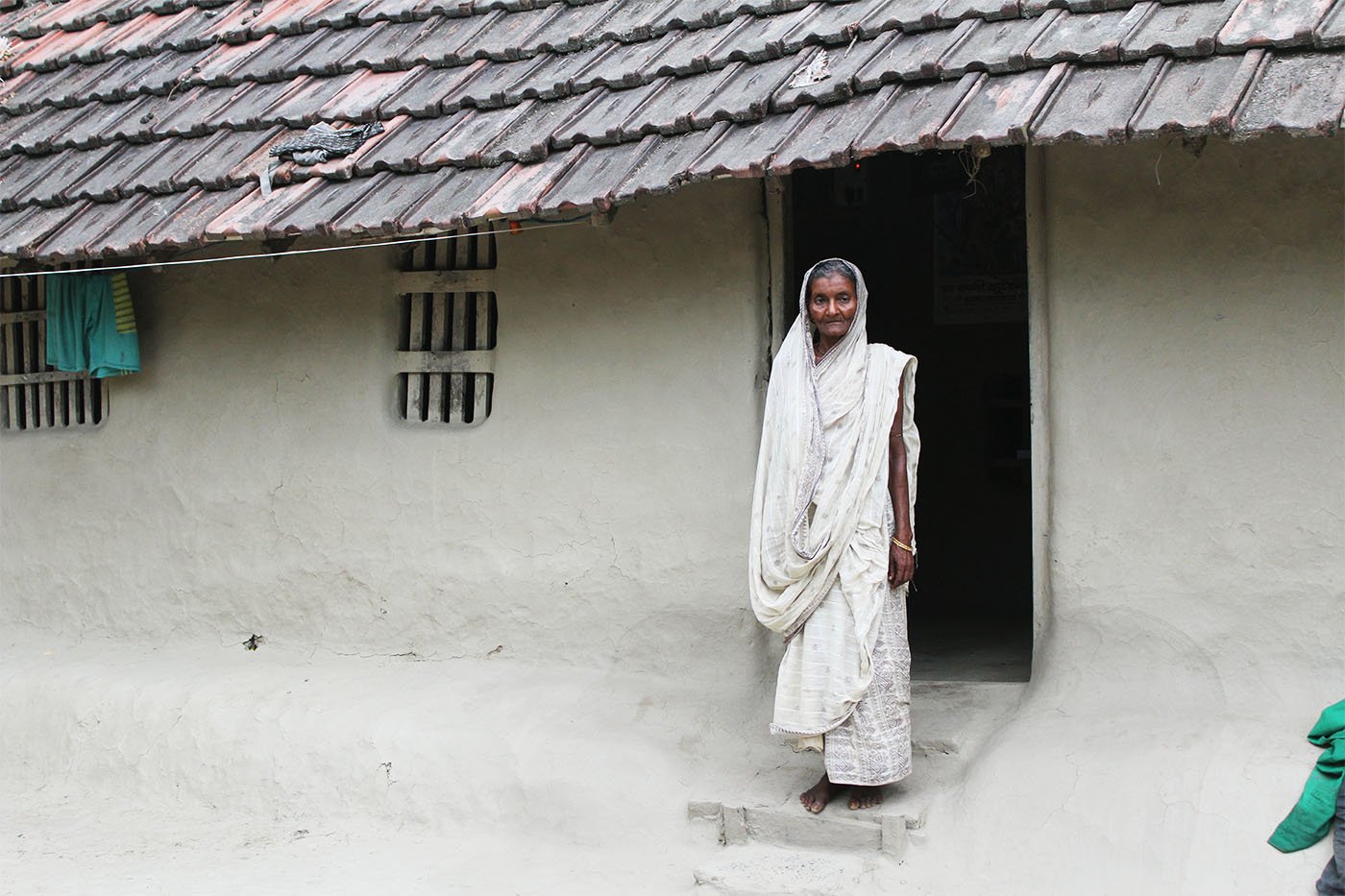 A women standing at her doorstep