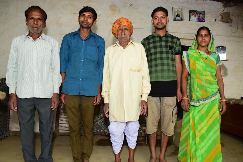 Left: Sukhlal Suliya with his family (left to right): son Badri, Badri's sons Deepak and Vijay, and Badri's wife Devaki. Right: With a few of his 17 grandchildren