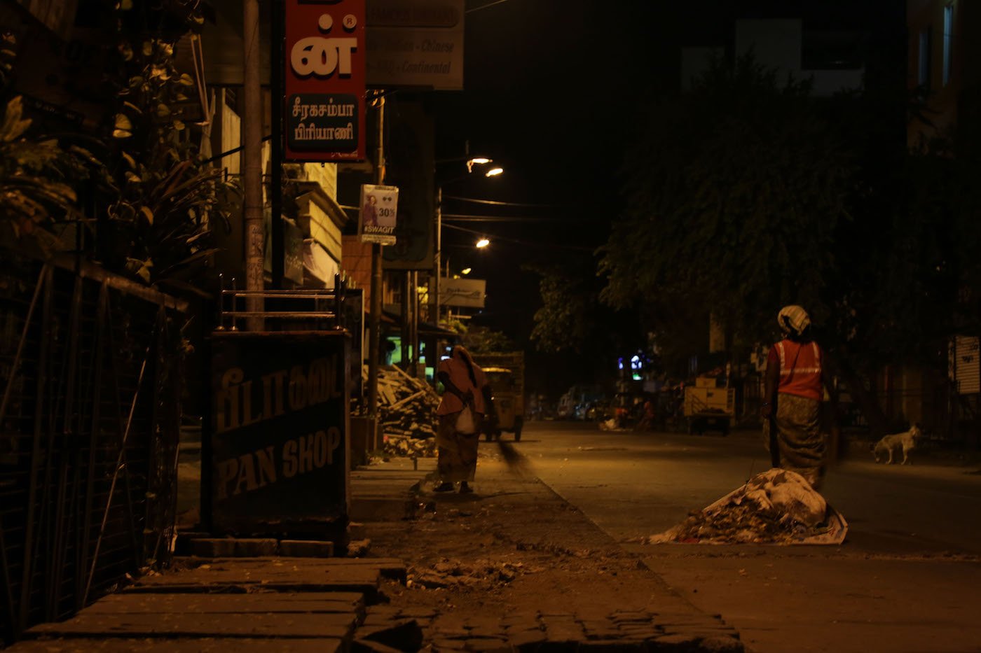 As the night progresses, so does the sweeping and collecting of garbage