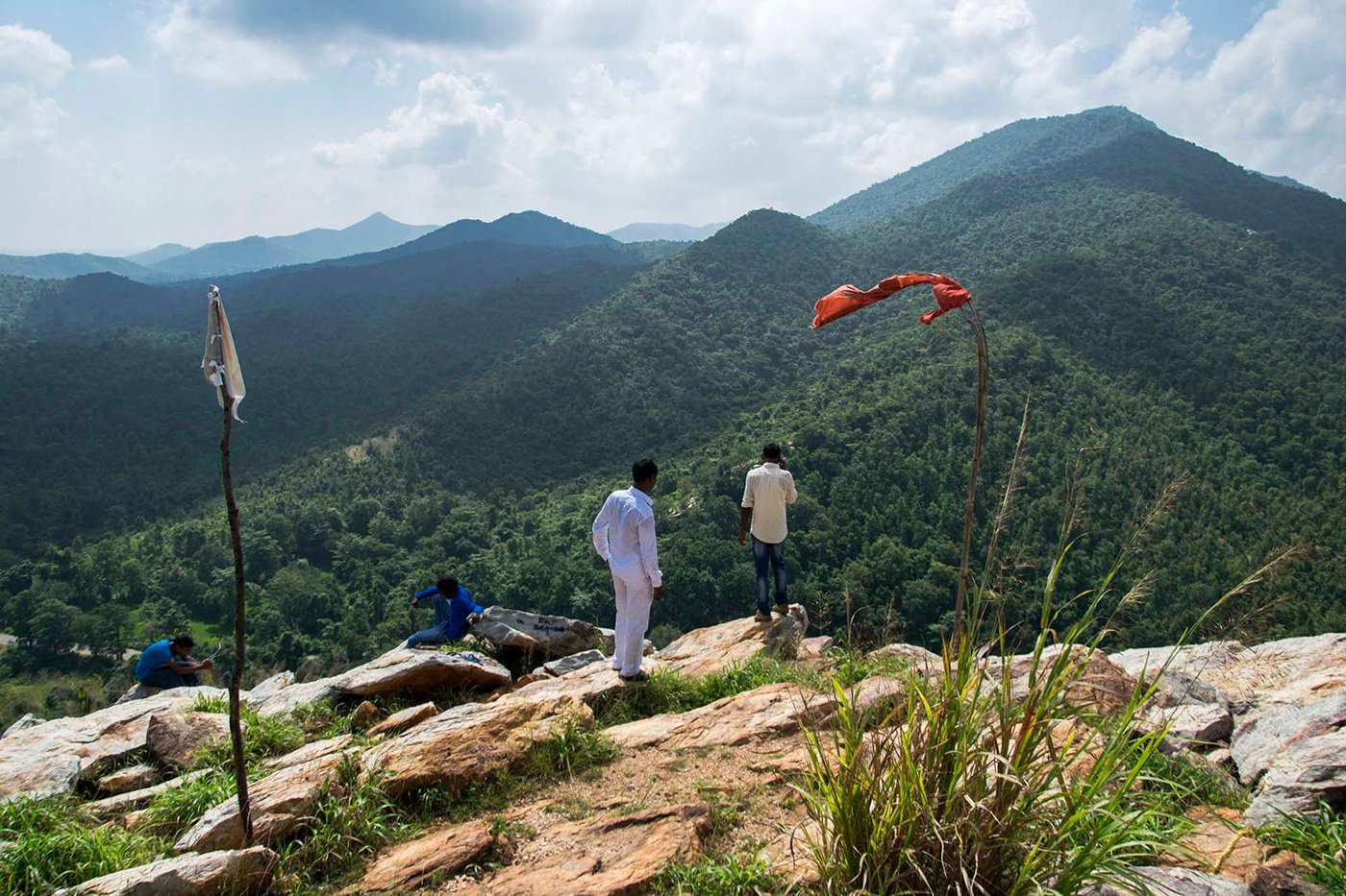 People' standing on the hill