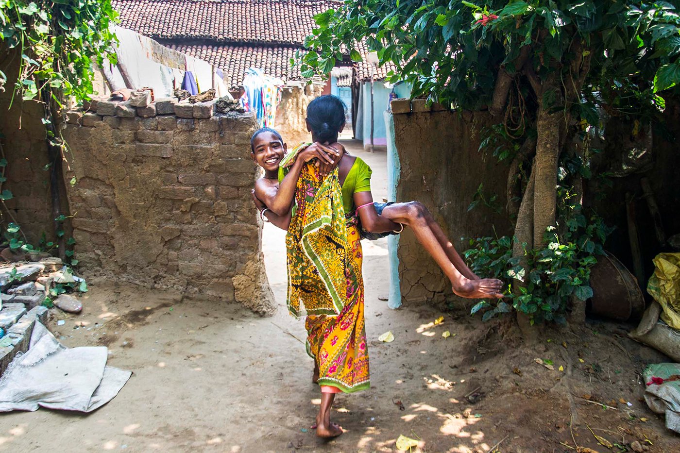 A women carrying her son