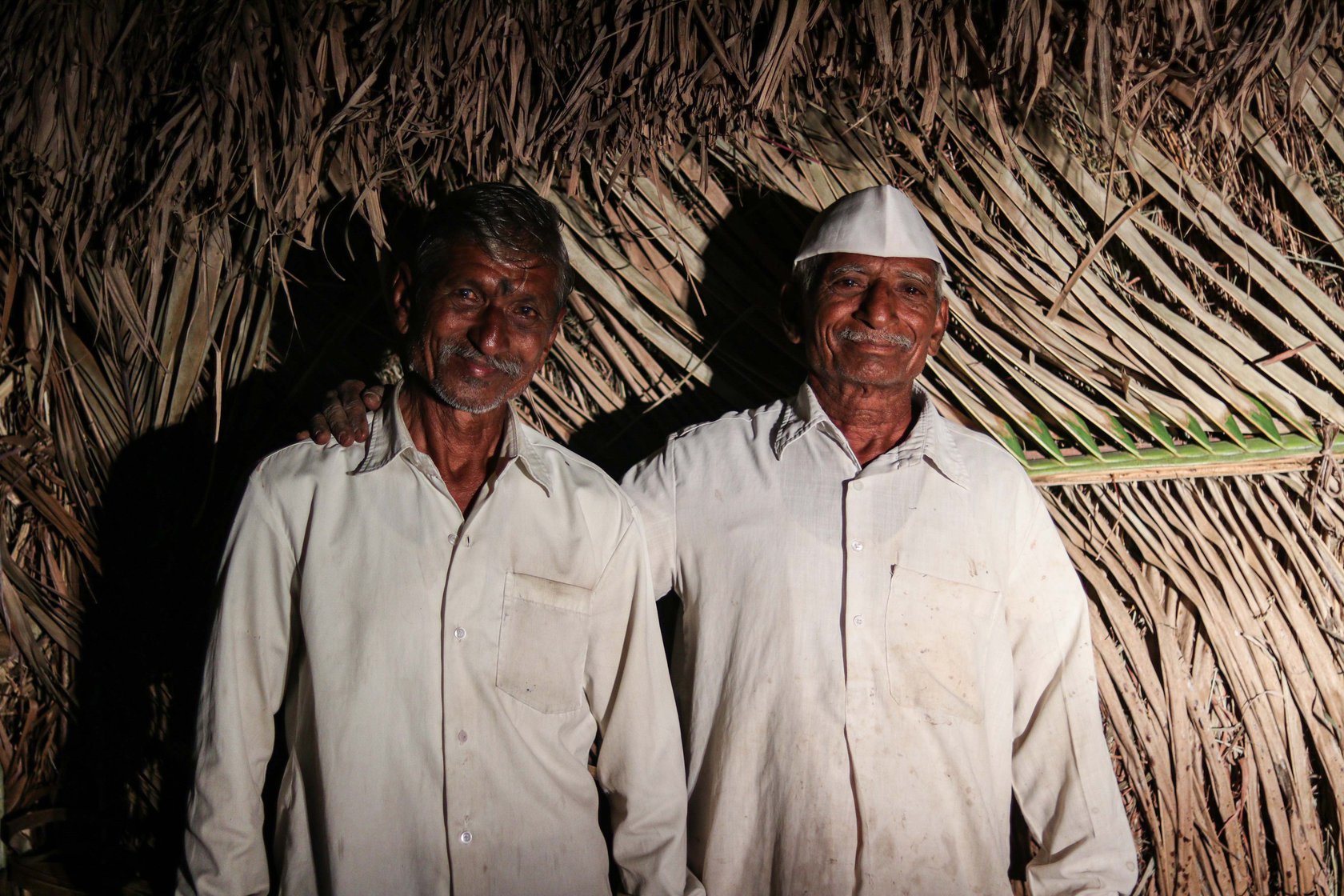 Vishnu Bhosale (standing on the left) and Narayan Gaikwad are neighbours and close friends who came together to build a jhopdi
