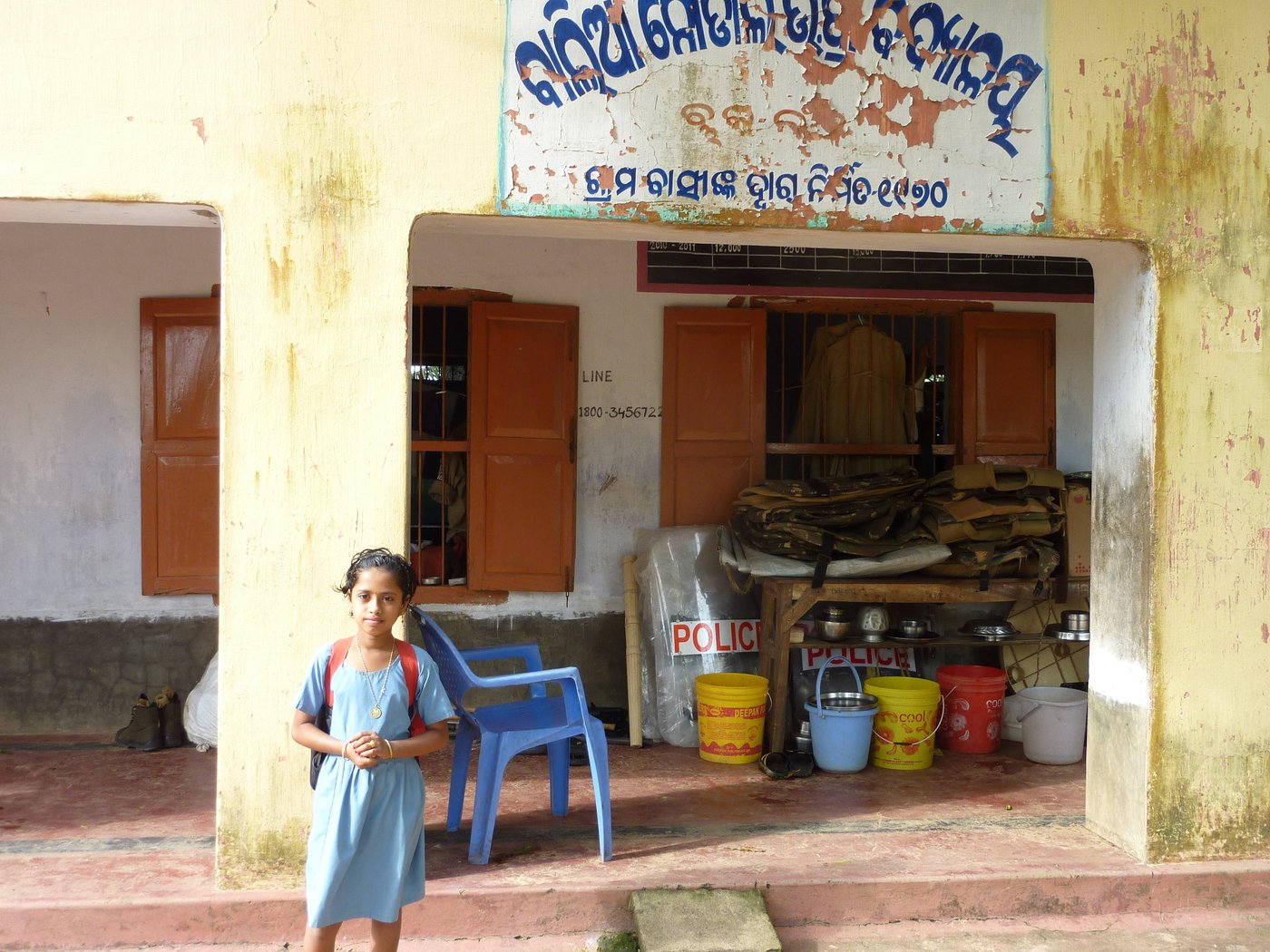 Child standing in front of primary school