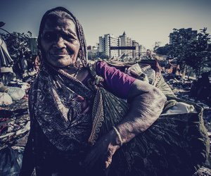 Tribal woman with sack of clothes