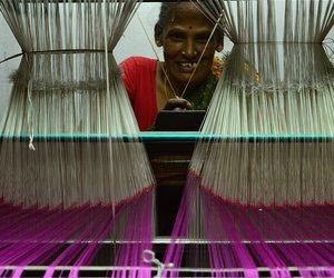 Woman weaving saree on handloom