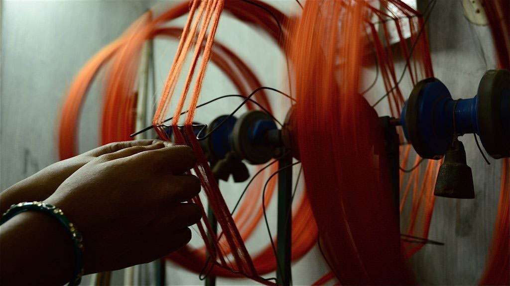 Woman's hands weaving