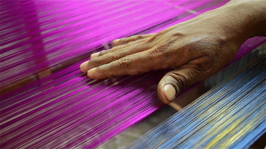 Hand on silk thread