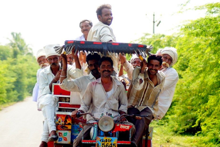Group of men riding 'Chakkadda' - part motorcycle, part cart - of rural Saurashtra