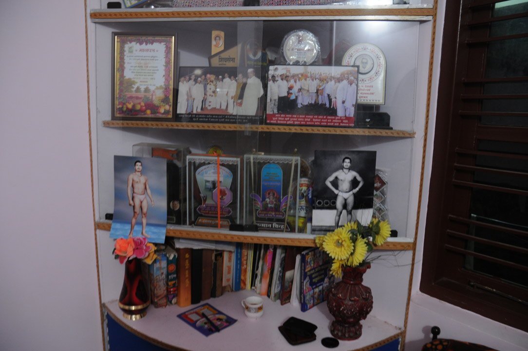 A showcase at the Pujari residence displays awards and mementos that Shankarrao has collected over the years