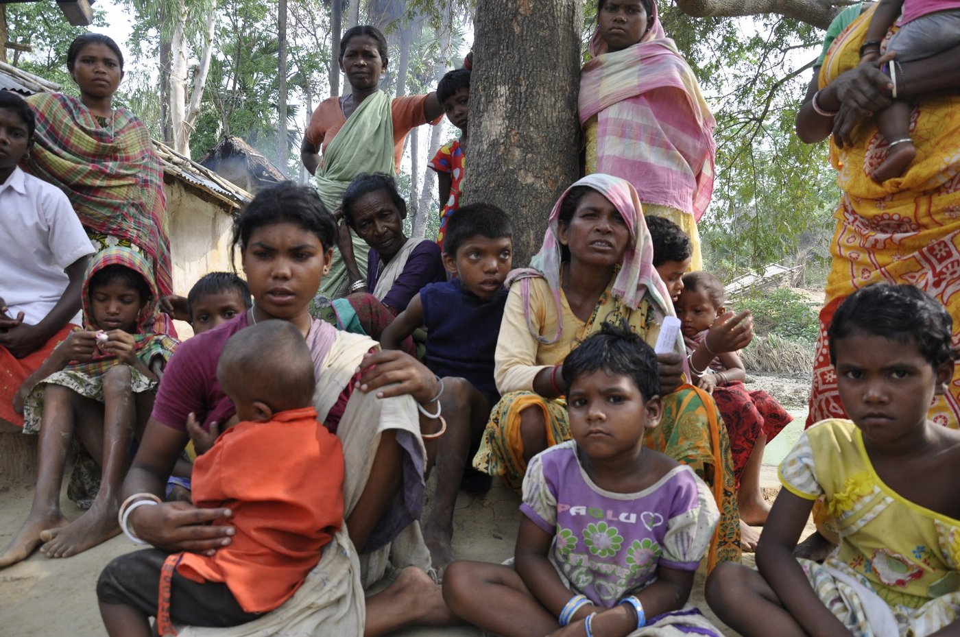 Group of tribal women sitting with their children